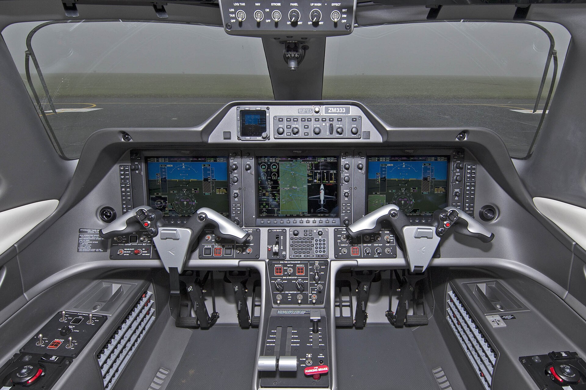Business jet flight deck with glass cockpit displays
